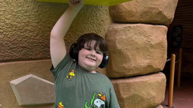 child with autism at an amusement park