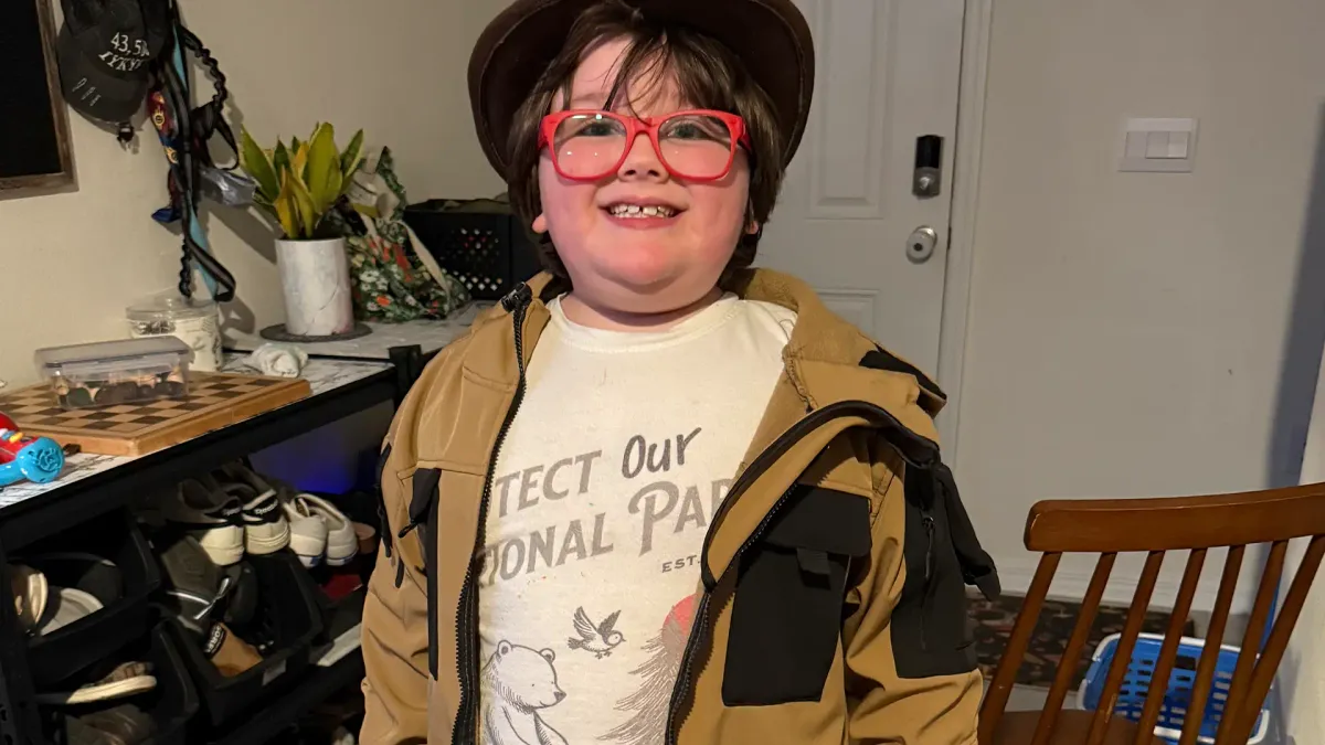 a little boy with autism dressed up as Indiana Jones